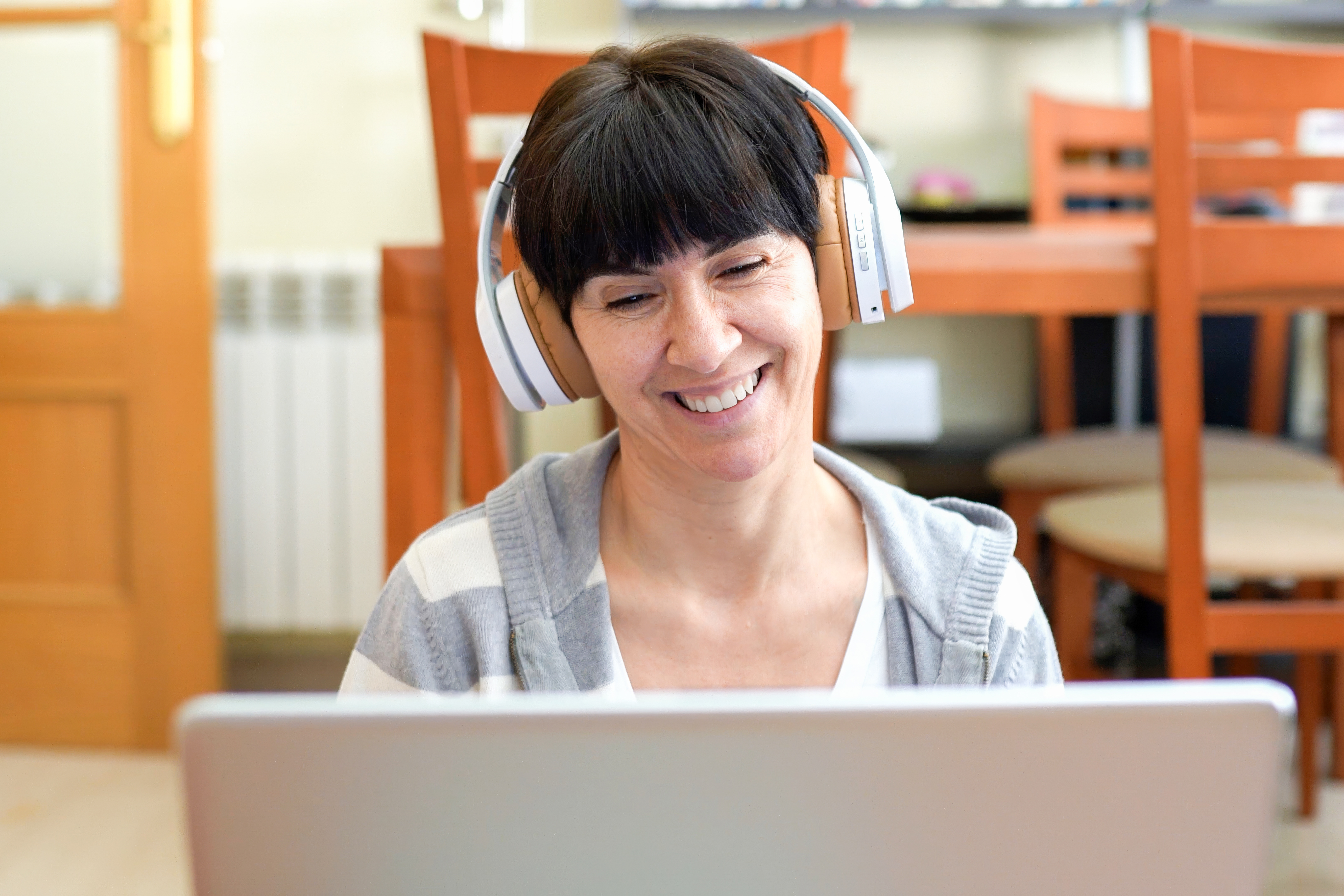 A woman joining a virtual conversation from home